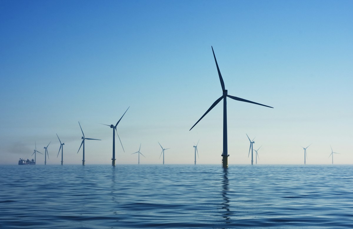 Engineers performing structural erection of wind turbine tower and nacelle